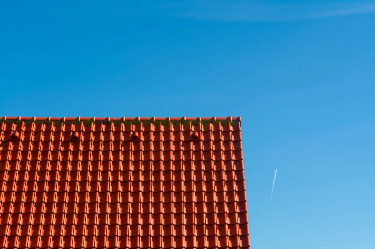 Tile roof gable in full sun, the kind of exposure that sets roof life in Anchorage, AK